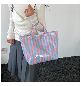 Pink and blue striped PVC tote bag, large capacity waterproof handbag for daily commute.