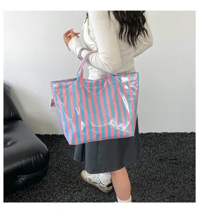 PVC striped tote bag detail, waterproof large capacity shoulder bag for daily commuting stylish.