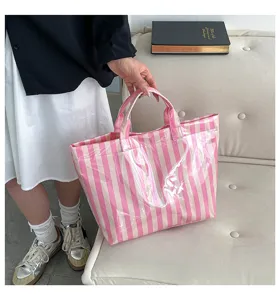 Pink and white striped PVC large capacity tote bag, stylish waterproof casual shoulder bag for women.