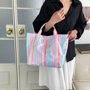 Colorful striped PVC tote bag for women, large capacity waterproof casual shoulder bag.