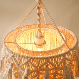 Handmade woven cotton rope lampshade detail, bohemian retro chic pendant light texture.