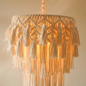 Handmade woven cotton rope lampshade detail, bohemian style tassel pendant light cover.