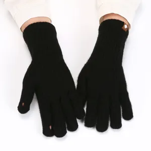 Black knitted fingerless gloves detail view, winter warm touch screen knit gloves for women.