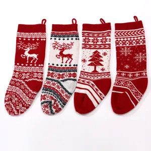 Knitted Christmas stocking candy bag detail, red and white holiday tree and reindeer design.