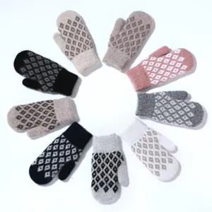Detail view of women's warm knit mittens featuring cozy diamond pattern for winter.