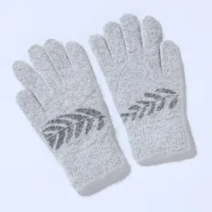 Knit winter gloves detail view, soft rabbit hair blend fabric with stylish leaf pattern warmth.
