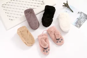 Plush winter mittens detail view, warm fuzzy gloves with cute cat claw design for women.