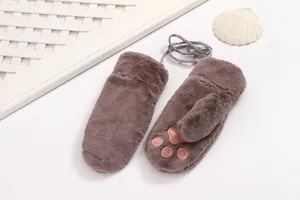 Close-up detail of plush brown winter mittens featuring cute pink cat paw pads and hanging string.