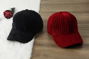 Corduroy baseball hat detail showcasing soft ribbed fabric, curved brim, and dual color options.