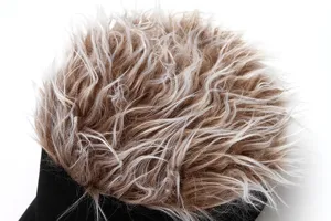 Close-up detail view of women's fashion wig hat with highlighted long curly hair.
