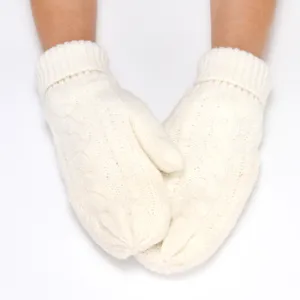 Close-up of thick knitted mittens detail, white winter warm hand wear accessory style.