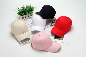 Detailed view of multi-color solid baseball caps set on a clean display grid rack.
