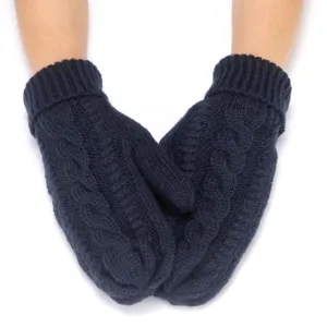 Detailed shot of dark blue chunky knit mittens with cozy cable pattern and ribbed cuffs.