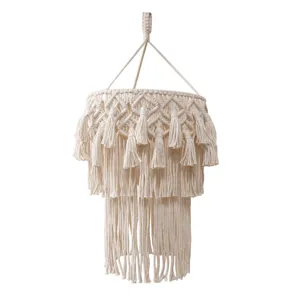 Detailed view of handmade woven cotton rope lampshade, boho multi-layer fringe design.