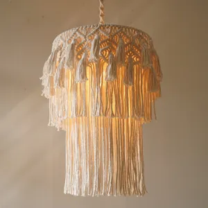 Hand-woven cotton rope pendant lampshade detail, bohemian style retro decor light fixture.