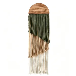 Handmade bohemian macrame wall hanging with wooden semicircle top and layered tassels.