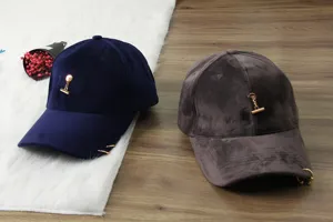 Velvet baseball cap for women and men, featuring metal chain and ring decoration, soft style.