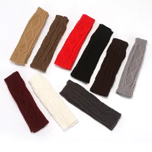 Detailed view of women knit arm warmers with classic cable diamond pattern winter warm.