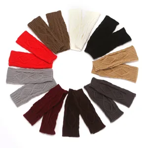 Detailed view of knitted fingerless gloves showing diamond cable texture and diverse colors.