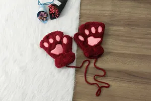 Cozy winter plush half-finger gloves featuring adorable cat paw design, soft and warm.
