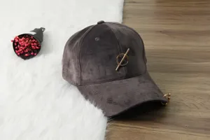 Dark grey velvet baseball cap featuring a chic metal ring and pin detail, autumn style.