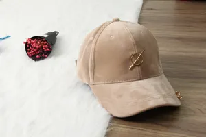 Beige suede baseball hat with stylish metal ring and bar detail for autumn and winter casual wear.