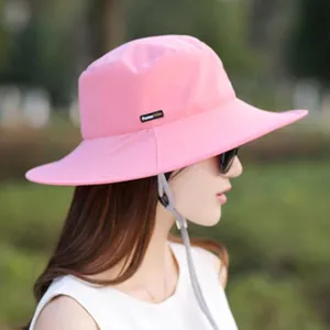 Pink sun protection bucket hat detail, wide brim outdoor UV blocking summer hat with lanyard.