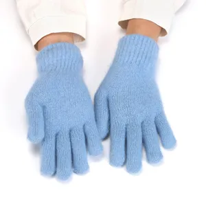 Close-up detail of soft light blue knitted winter gloves, warm double-layer fluffy texture