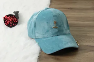 Blue velvet baseball cap with metal pendant detail, trendy curved brim hat for women daily wear.