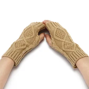 Knitted fingerless gloves detail, cable knit warm winter wrist sleeves, cozy diamond pattern.