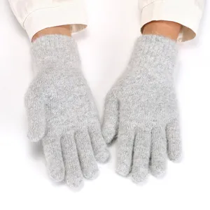 Close-up of women's winter warm fuzzy knit gloves, soft plush texture and solid grey color.