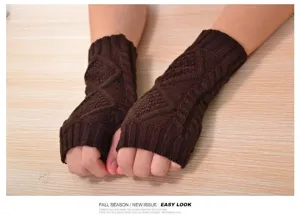 Close-up view of brown winter warm knit fingerless gloves featuring stylish cable pattern.