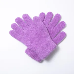 Close-up detail of soft purple winter knitted gloves, warm plush texture for cold days.