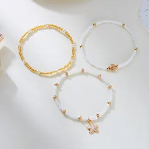 Boho summer beach beaded bracelet set featuring cute starfish and shell pendants for women.