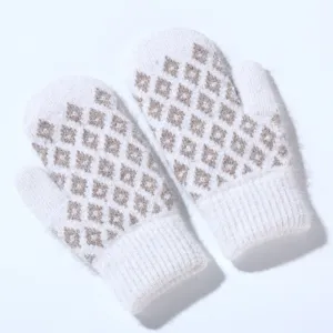 Detail shot of winter warm knitted jacquard mittens with thick fleece lining for cold weather.