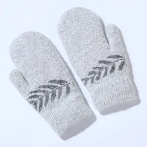 Grey fuzzy knit mittens detail showing soft plush texture and delicate dark grey leaf pattern.