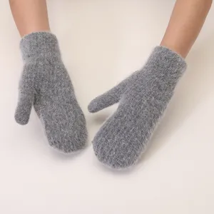 Grey plush fluffy winter mittens detailed close-up shot showcasing soft warm rabbit hair texture.