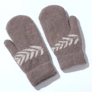Detailed view of plush rabbit fur winter mittens with knitted leaf pattern, soft and warm texture.