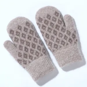 Close up of fluffy knitted winter mittens texture, warm diamond pattern detail view indoors