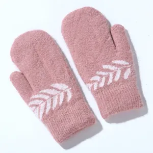 Pink fuzzy knit mittens detail showing soft plush texture and cute white knitted leaf pattern.