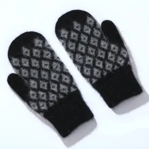 Detailed view of women winter warm knitted mittens, black and gray diamond pattern fuzzy gloves.