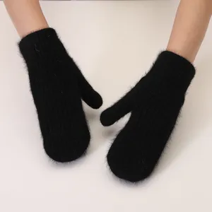 Close-up detail of soft black plush winter mittens, fluffy warm fabric texture for cold days.