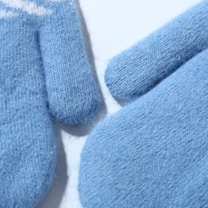 Close-up detail of soft blue winter plush mittens showing fuzzy knit texture and warmth.