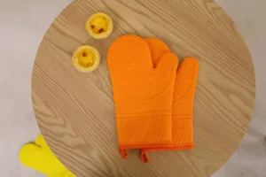 Heat resistant silicone oven mitts for baking, cooking, and kitchen use with anti-slip grip.