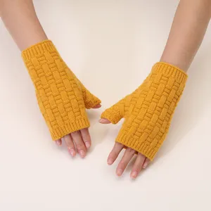 Stay warm and stylish this winter with these cozy yellow knit fingerless gloves for women.