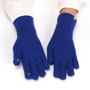 Close-up of blue knitted fingerless touch screen gloves for women, winter warm knitwear detail.