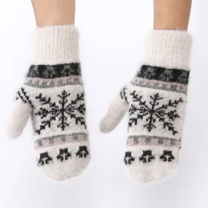 Detailed view of women winter warm fluffy rabbit fur knit gloves with snowflake pattern.