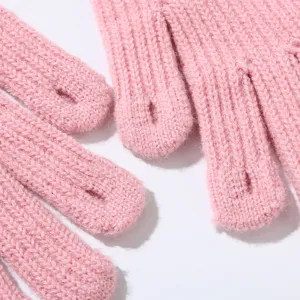 Pink knit fingerless gloves detail showcasing soft ribbed texture and warm winter design.