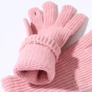 Pink knitted gloves detail close-up showing soft textured ribbed cuff and warm winter design.