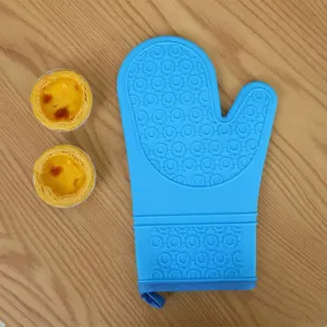 Blue silicone oven mitt with anti-slip texture and hanging loop for safe baking use.